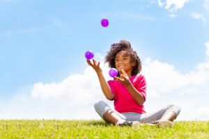 Positive,Happy,Girl,Juggle,Balls,On,The,Grass 3