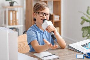 Little,Journalist,With,Microphone,Having,An,Interview,In,Office 3